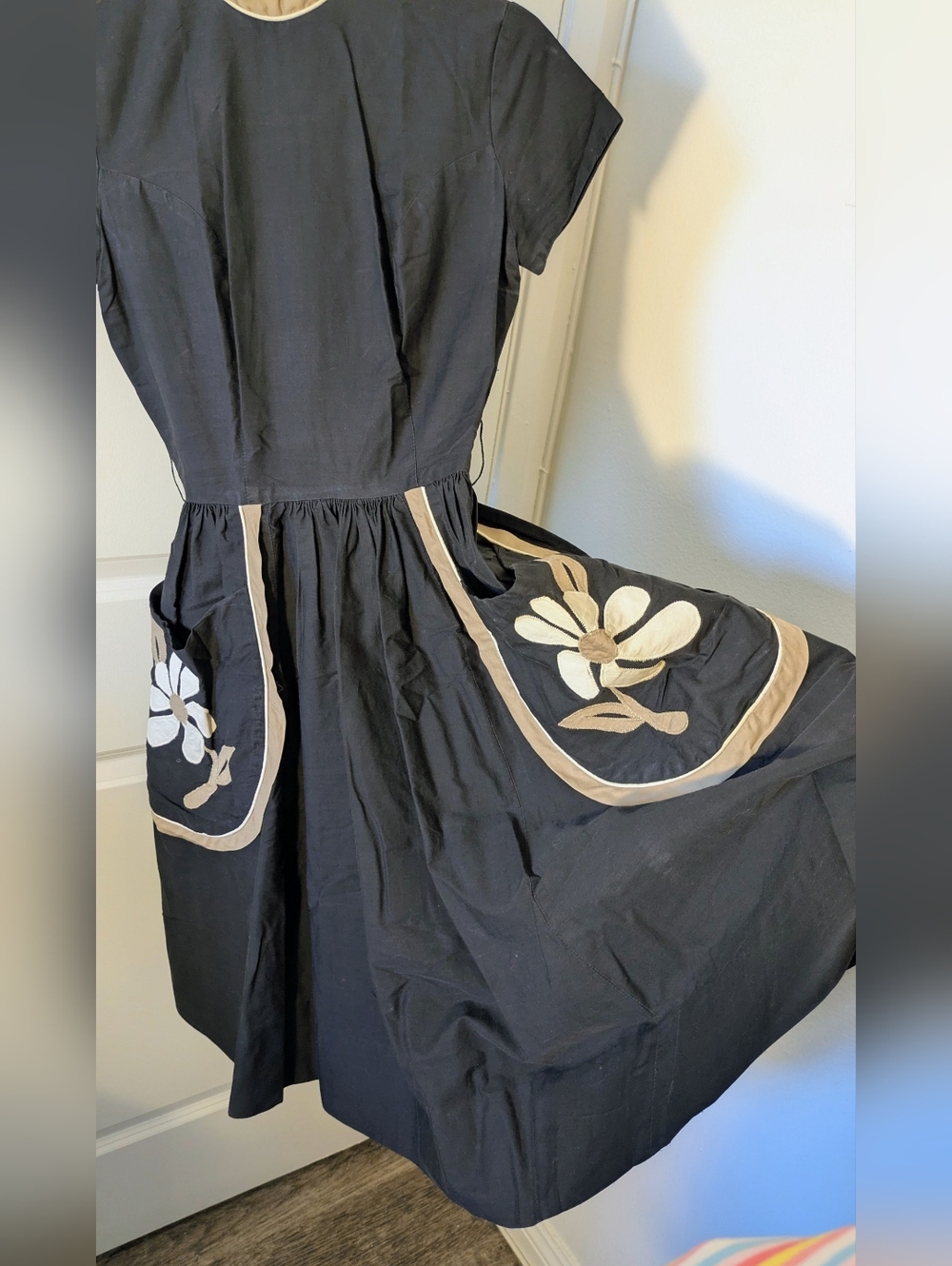 Vintage 1950s–60s black dress with beige trim & machine-sewn floral appliqué